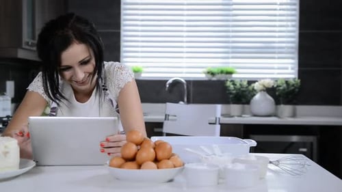 Attractive Brunette Woman Using Tablet Computer While Backing Adult