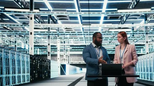 Data Center Coworkers Collaborating to Manage Cloud Computing IT Solutions