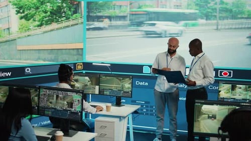 Diverse Employees Using CCTV Surveillance System in Monitoring Traffic