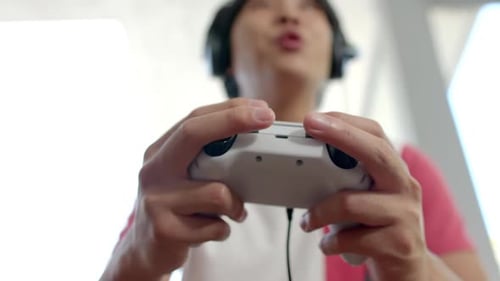 Young Adult Gamer Playing Video Game Controller Focus