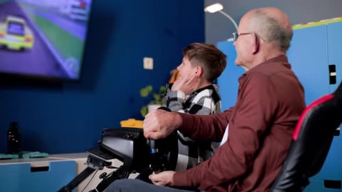 Grandfather and Grandson Playing Racing Game Together