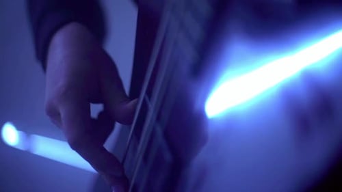 Human Hands Playing On Electric Guitar. Closeup Shot Of Rock Musician Playing Guitar On Stage Wit...