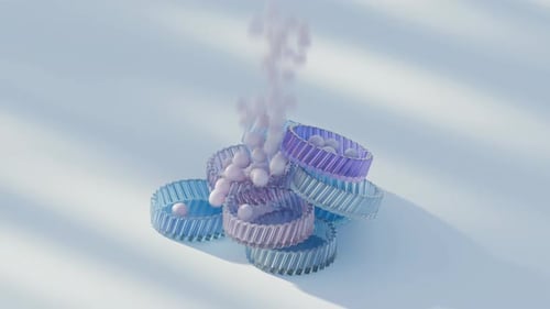 Soft Pastel Spheres Filling and Piling Up Around Fluted Rings