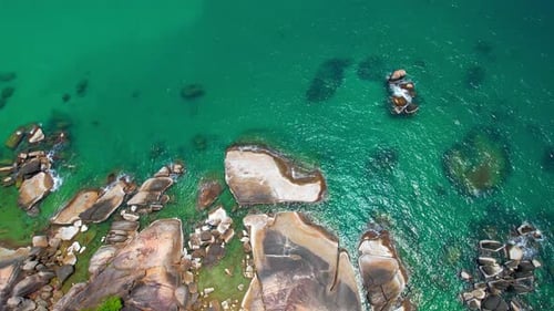 Rocky shores surrounded by crystal clear waters.