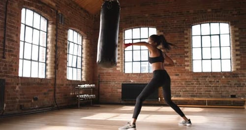 Woman, boxing and exercise in a gym with workout and boxer training for wellness and health