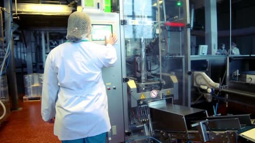 Operator Cnc And Packaging Production/Worker Operates Industrial Computer At Factory/Production T...