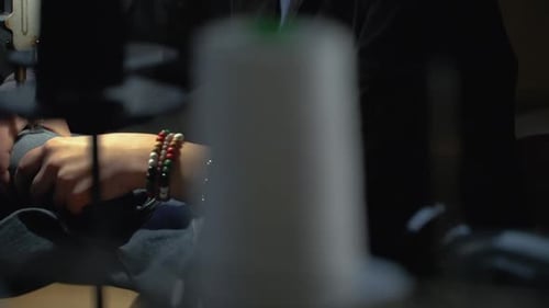 Craftsperson Sews Garment on Vintage Sewing Machine