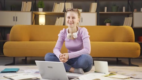 Smiling college student looking camera.
