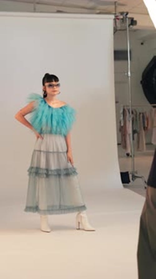 Fashion, photography and stylist with model in studio for bts shooting, magazine