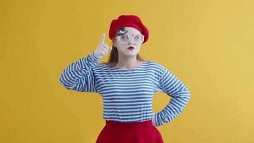 Pantomime Makes a Performance on a Yellow Background
