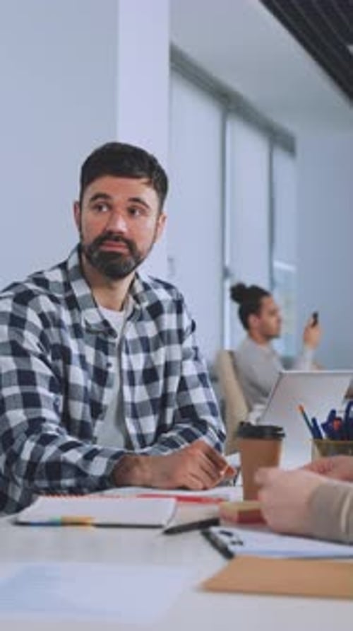 Business Meeting Concludes with Agreement and Handshake