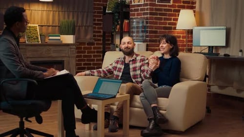 Couple Talking With Counselor in Office Setting