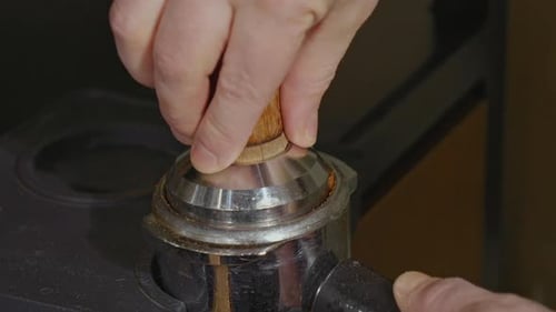 Tamping Espresso Grounds in a Portafilter Close Up