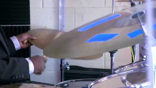 Male musician playing the drum.