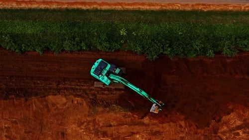Aerial of Excavator Digging on Construction Site