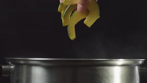Adding Sliced Kabocha Squash to Steaming Pot