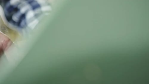 Close Up of a Man Manually Lathing a Piece of Wood