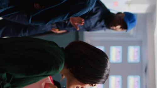 Shoppers browse clothes in a well-lit boutique