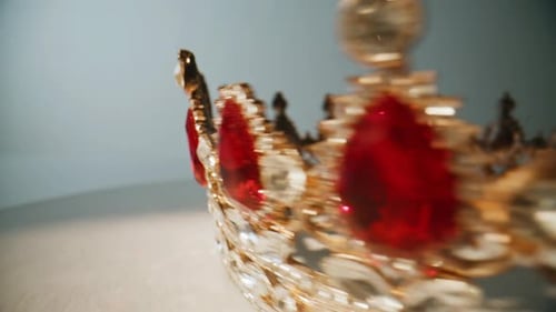Ornate gold crown with red and white jewels