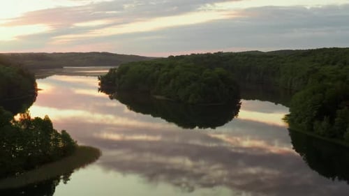 Amazing Lake From Above Aerial Drone Flies Low Over Water Surface During Sunrise Beautiful Island