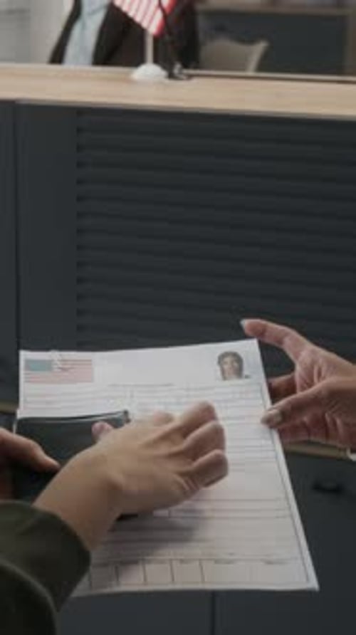 Vertical of Anonymous Woman Applying for American Visa at Embassy