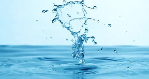 Drop of water falls into a drop of water in a super slow motion. Shot on super slow motion 1600 fps.