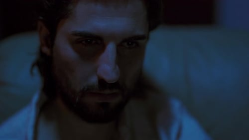 Handsome Guy Falling Asleep While Watching Television In The House At Night - close up