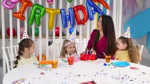Children Celebrate Birthday with Cake and Balloons