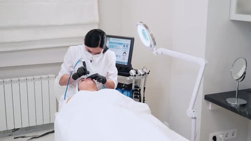 Aesthetician Performs Hydrafacial on Client in Modern Beauty Clinic Skincare Treatment with