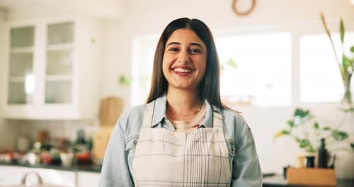 Smiling Woman Posing in a Bright Kitchen