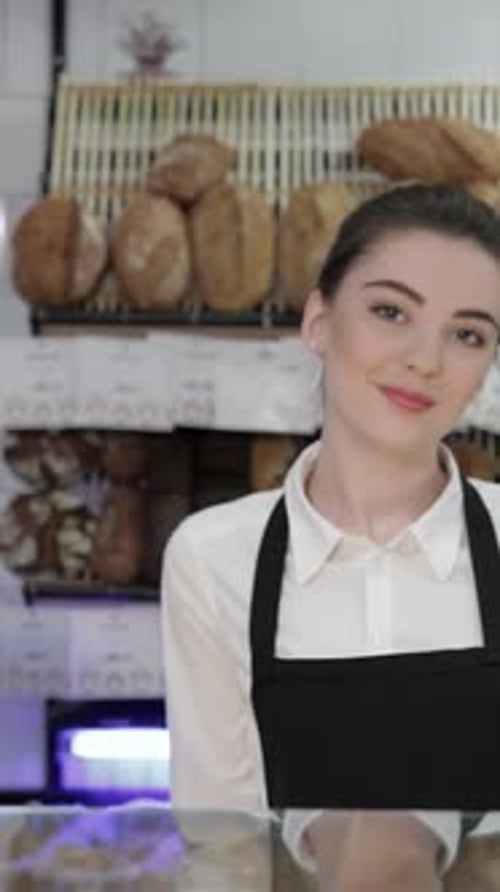Cheerful Woman Baker Warmly Welcoming Customers Into Her Cozy Bakery