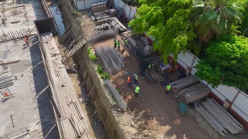 Aerial View Workers Constructing LoadBearing Walls and Floors