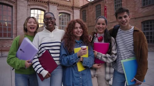 Smiling Students with Notebooks Outside School Building