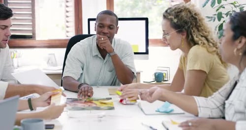 4k video footage of a group of young businesspeople having a meeting in a modern office