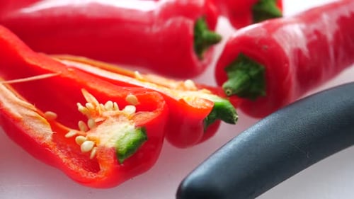 Bright Red Peppers on White Background
