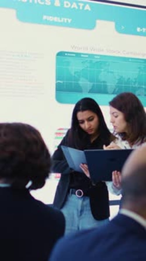 Vertical Video Coworkers Team Analyzing Infographics to Provide Solutions on an Issue