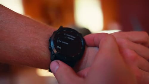 Man Showing Health Timer Of Solar Charging Smartwatch On His Wrist. selective focus