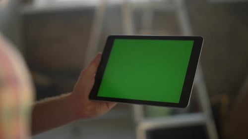 Unknown Woman Hand Touching Green Screen Tablet Computer. Closeup Woman Hand Holding