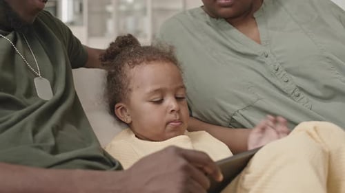 Family Relaxing Together with Tablet at Home