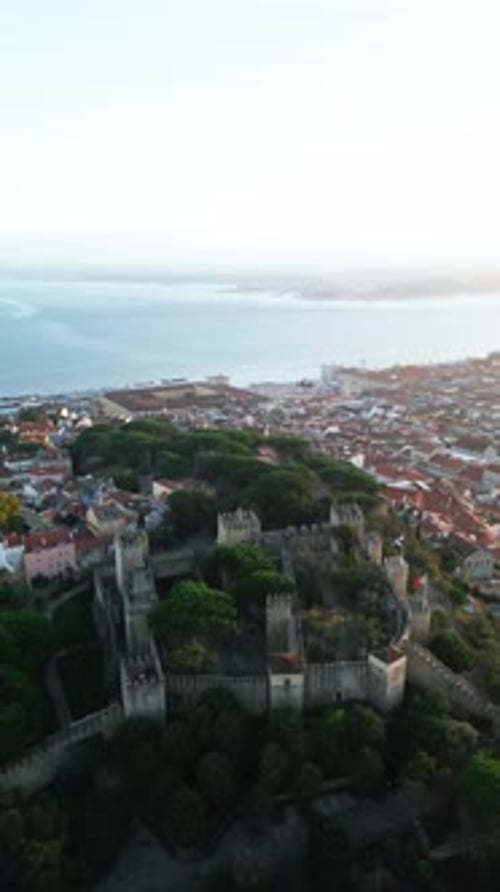 Aerial video in the center of the old city of Lisbon, with the Tagus River in the background