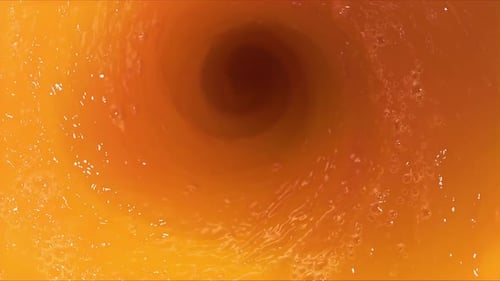 Super Slow Motion Shot of Fresh Peaches Falling Into Juice Whirl