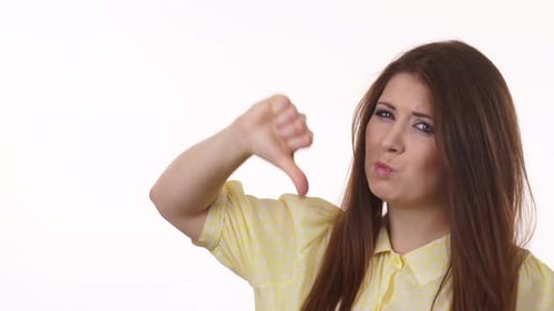 Woman Expressing Dislike With Thumbs Down Gesture