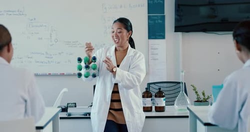 Engaging Science Teacher Explains Molecular Structure to Class