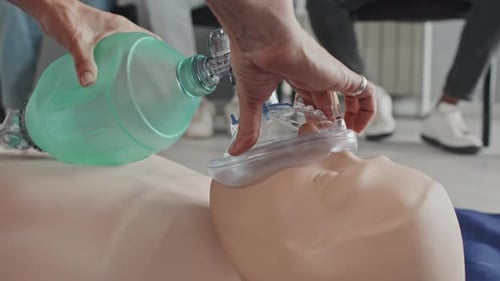 CPR Practice on Medical Dummy With Mask