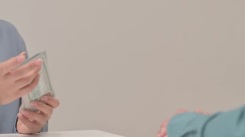 Close Up of Woman Giving Money