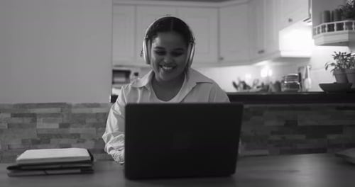 African Girl Using Laptop Computer at Home While Working on School Project Africa