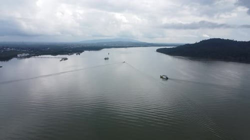 Ferries carry passengers sailing on the Kalimantan sea