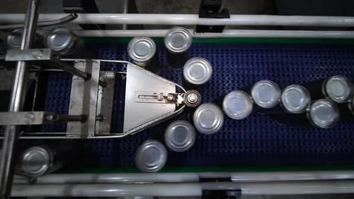 Conveyor line with the production of aluminum cans. Production of aluminum cans for drinks. Plant of