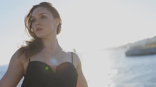 Young Woman Dancing Gracefully By the Sea in Slow Motion