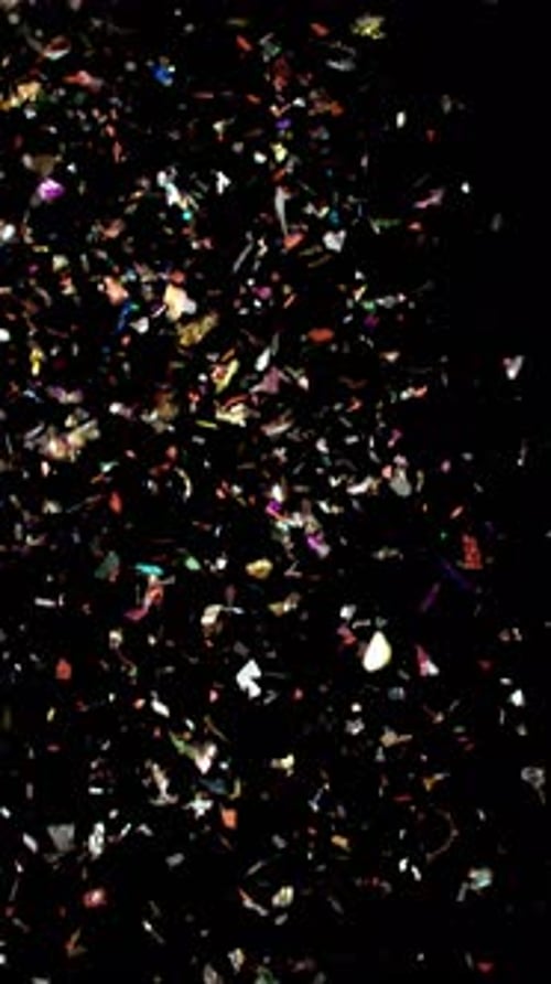 Shiny Multicolored Confetti Falling In Slow Motion